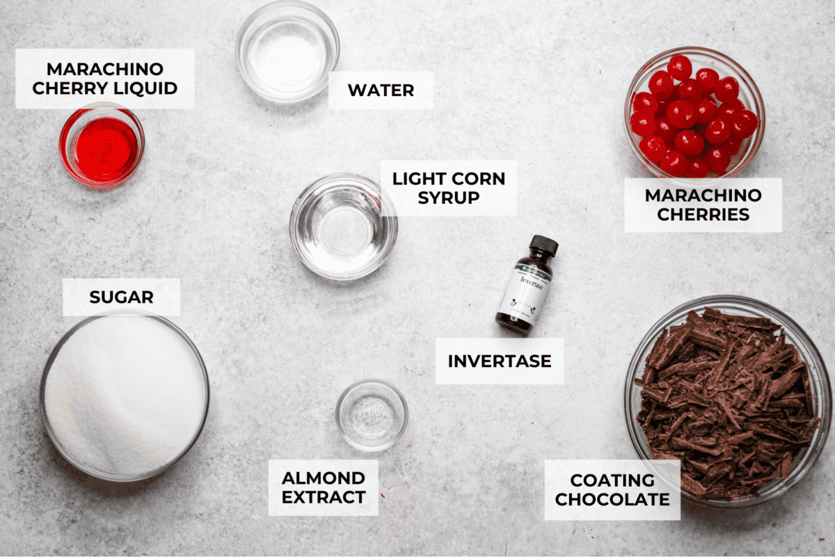 Homemade cherry cordials are a tasty, nostalgic treat! They're made with sweet cherries that are coated in a rich chocolate shell. Make them for Christmas or Valentine’s Day, and watch them disappear! Overhead shot of labeled ingredients.