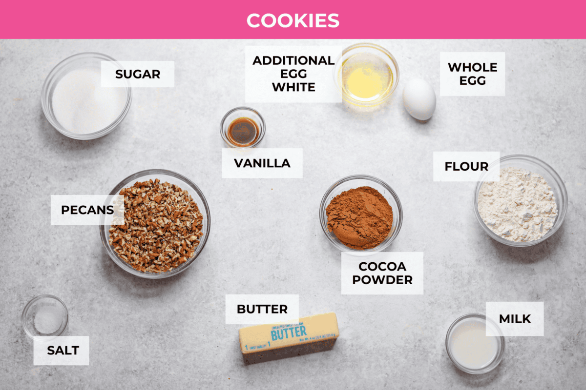 Turtle Cookies are a baked, bite-size brownie loaded with pecans, then filled with a creamy caramel center for a rich, decadent holiday cookie! These turtle cookies are always a huge hit and are gone in minutes Overhead shot of labeled cookie ingredients.