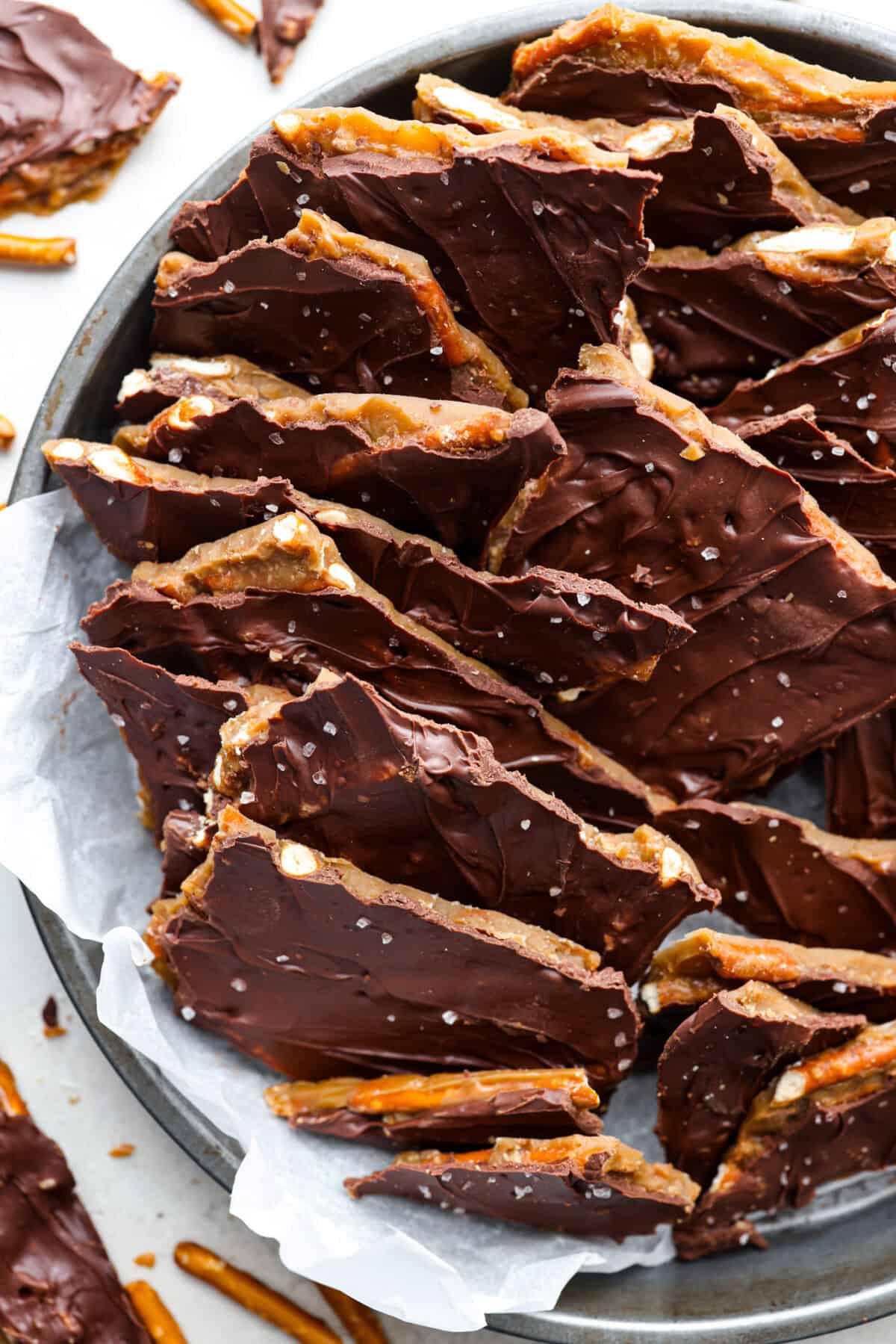 Pretzel Christmas Crack is the best holiday treat! This addictive combination of salty pretzels, rich toffee, and chocolate is sure to be a hit at any party or gathering. Overhead shot of Pretzel Christmas Crack in a serving dish.
