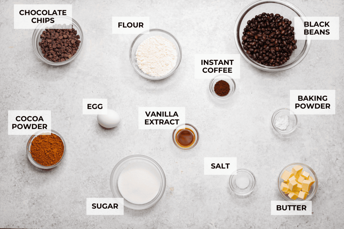 Black bean brownies are rich, fudgy, and packed with chocolatey goodness! They have a slightly denser texture, similar to a protein bar, but still satisfy that brownie craving. While adults may notice a slight difference from traditional brownies, kids won’t be able to tell! Overhead shot of labeled ingredients.