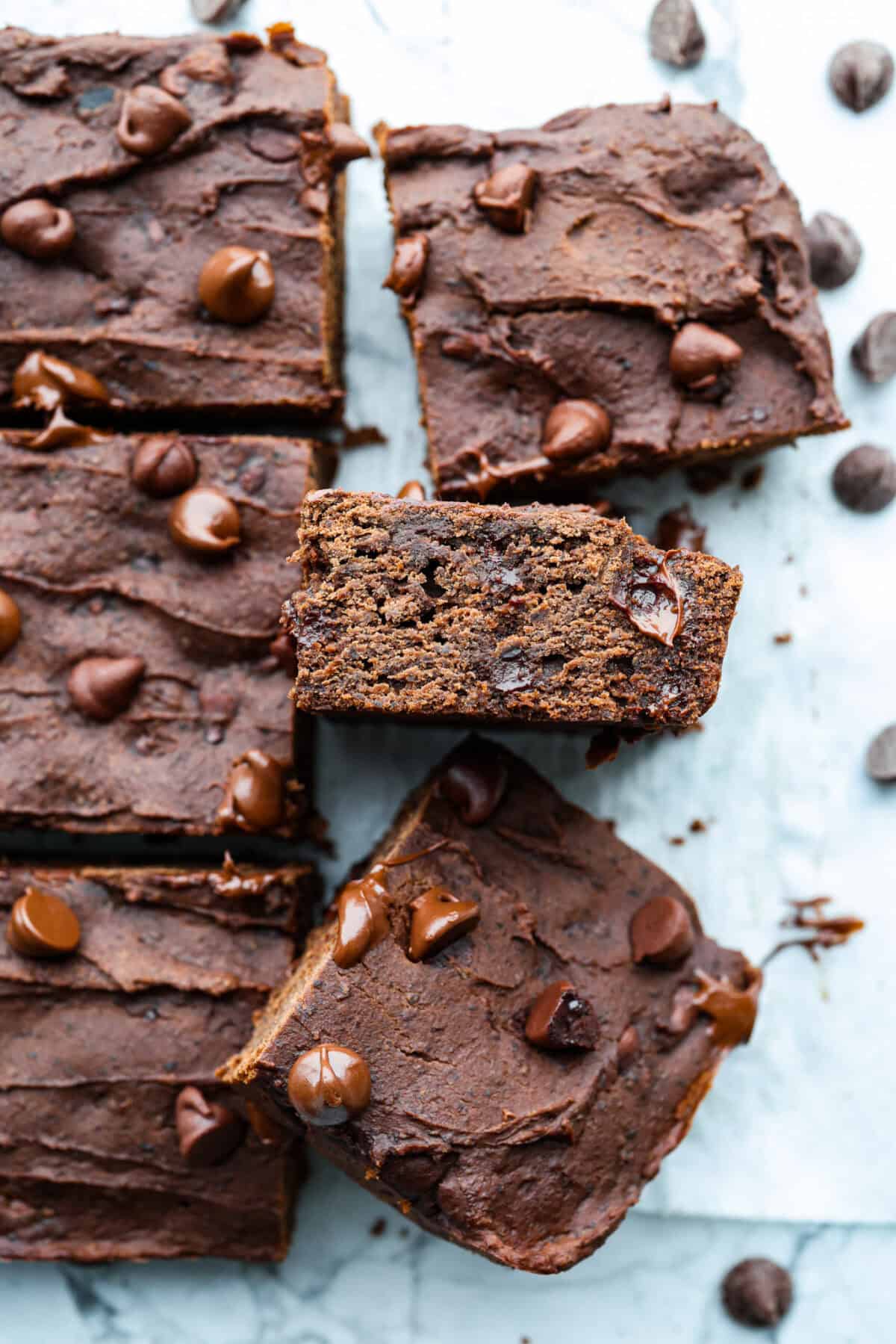 Black bean brownies are rich, fudgy, and packed with chocolatey goodness! They have a slightly denser texture, similar to a protein bar, but still satisfy that brownie craving. While adults may notice a slight difference from traditional brownies, kids won’t be able to tell! Close up shot of black bean brownies.